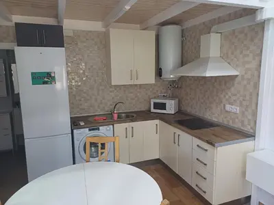 a small kitchen with white cabinets and a sink at Loft Ribera Centro Izquierdo in El Puerto de Santa María