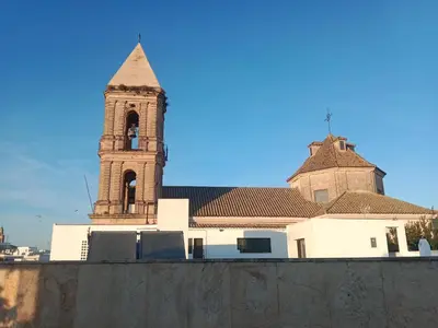 a building with a clock tower in the background at El Loft de la Reina - Apartamento Interior in Jerez de la Frontera