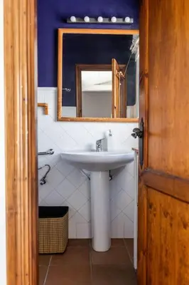a bathroom with a sink and a mirror at Loft/Attic, Sea Views, Private Terrace in Cádiz