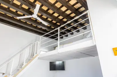 a staircase in a building with a wooden ceiling at Loft/Attic, Sea Views, Private Terrace in Cádiz