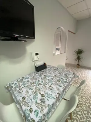a room with a flat screen tv on the wall at Central train station appartament in Jerez de la Frontera