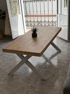a wooden table with a potted plant on top of it at Cabildo 3 in Sanlúcar de Barrameda