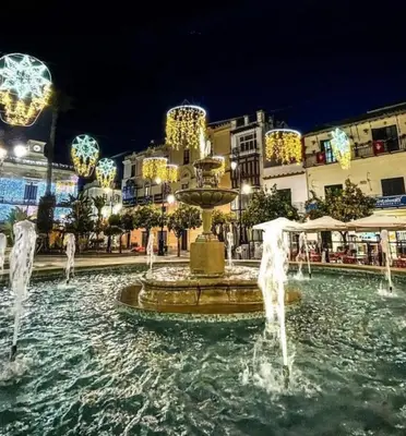 a fountain in the middle of a city at night at Cabildo 3 in Sanlúcar de Barrameda