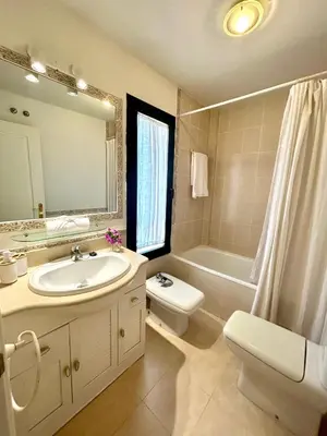 a bathroom with a sink and a toilet and a mirror at GATU PREMIUM Villa Sal Marina 