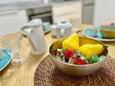 a bowl of fruit with strawberries on a table at GATU PREMIUM Villa Sal Marina 