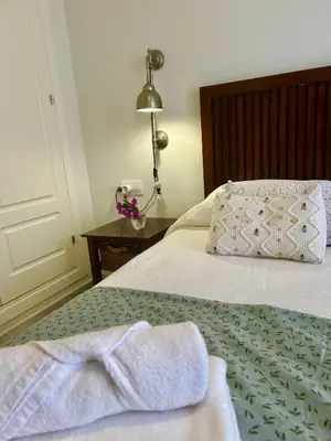 a bedroom with a bed with towels on it at GATU PREMIUM Villa Sal Marina 