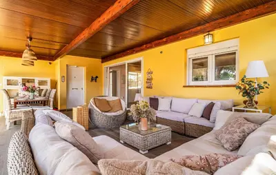 a large living room with couches and chairs at Nice Home In Chiclana De La Fronter in Novo Sancti Petri