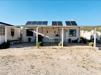 a house with solar panels on the roof at Casa Rural El Pequeño Oasis in Arcos de la Frontera