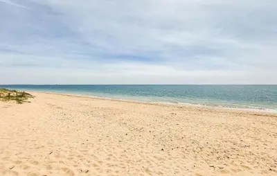 a sandy beach with the ocean in the background at 2 Bedroom Stunning Apartment In Rota in Rota