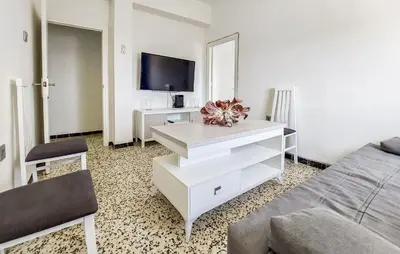 a living room with a couch and a tv at 2 Bedroom Stunning Apartment In Rota in Rota