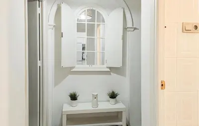 a bathroom with a white sink and a window at 2 Bedroom Stunning Apartment In Rota in Rota