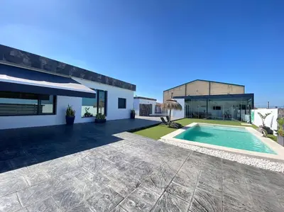 an image of a house with a swimming pool at Chalet Benamejí in Sanlúcar de Barrameda