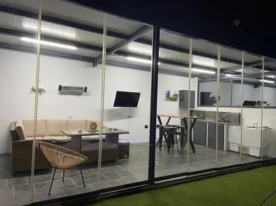 a living room with a couch and a table at Chalet Benamejí in Sanlúcar de Barrameda
