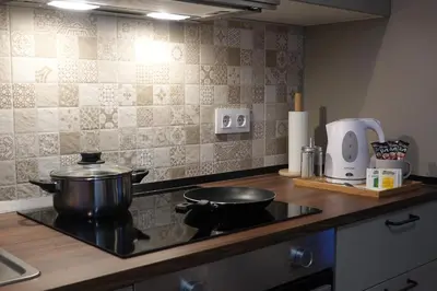 a kitchen with a stove with a pot on it at Apartamento Casa Dalí in Jerez de la Frontera