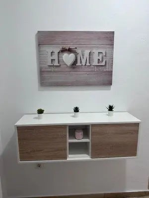 a desk with a heart picture on a wall at Solera in Jerez de la Frontera
