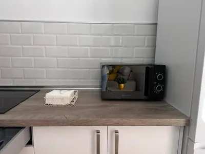 a microwave sitting on top of a kitchen counter at Solera in Jerez de la Frontera