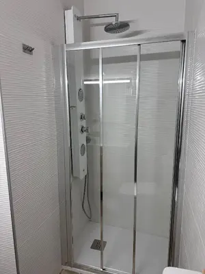 a shower with a glass door in a bathroom at Solera in Jerez de la Frontera