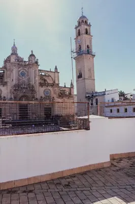 a large building with a clock tower in the background at Solera in Jerez de la Frontera