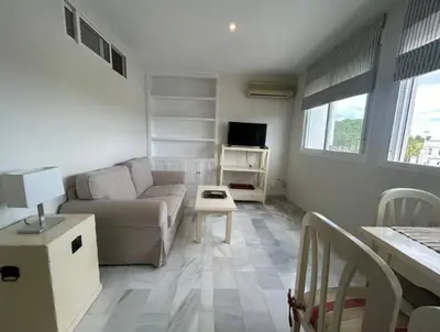 a living room with a couch and a table at Apartoyou - Vistahermosa Lux in El Puerto de Santa María