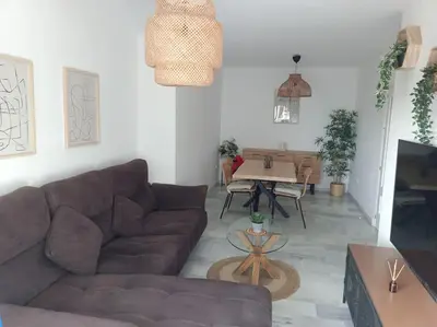a living room with a couch and a table at Apto en El Puerto de Santa María in El Puerto de Santa María
