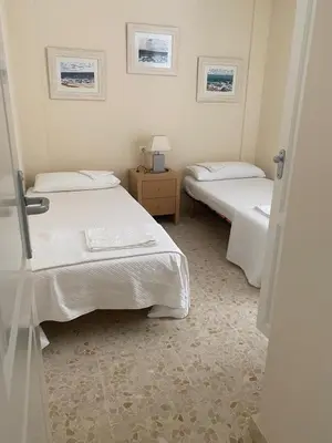 a living room with chairs and a couch on a balcony at Casa en Sancti Petri junto a playa La Barrosa in Chiclana de la Frontera