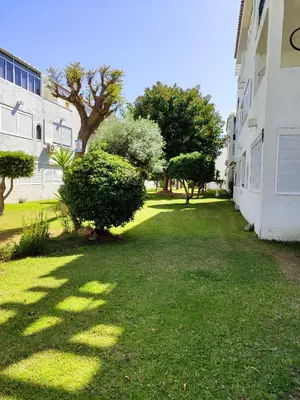 a hallway with a mirror and a white door at ESCAPADAS ROMÁNTICAS Gavira Apartamento in Rota