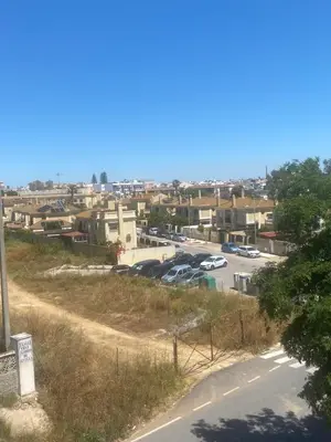 a view of a parking lot with cars parked at Sanlúcar mar in Sanlúcar de Barrameda