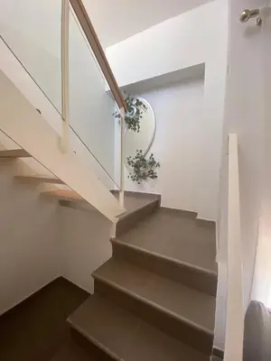a staircase in a house with a plant at Sanlúcar mar in Sanlúcar de Barrameda