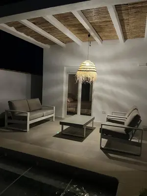 a living room with a couch and a table at La Fontaniega in Cádiz