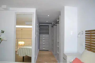 a bedroom with a closet with a bed in it at Apartamento en Playa Victoria in Cádiz