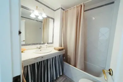 a bathroom with a sink and a shower at Andalusian beach haven villa in El Puerto de Santa María