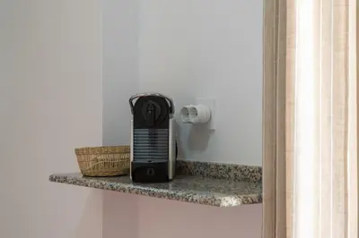 a black appliance sitting on a shelf in a room at Casa Palacio la Mar Salá in El Puerto de Santa María