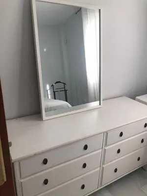 a white dresser with a mirror on top of it at Centro de Sanlúcar in Sanlúcar de Barrameda