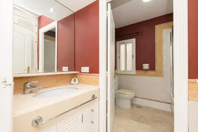 a bathroom with a sink and a toilet at Playamar in Cádiz