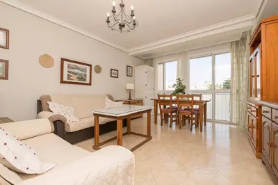 a living room with a couch and a table at Playamar in Cádiz
