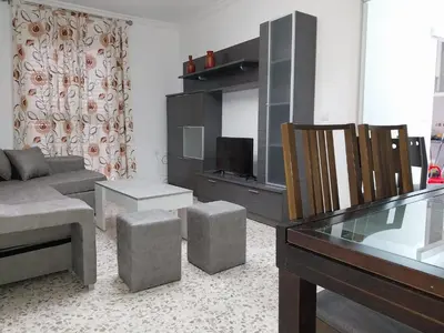 a living room with a couch and a television at Brisas de Puerto Real in Puerto Real