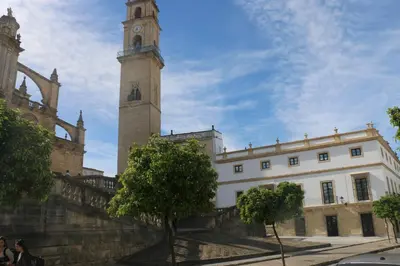 a building with a clock tower on top of it at Hotel Boutique Sidonia in Jerez de la Frontera