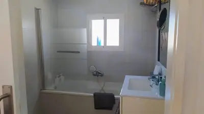 a bathroom with a tub and a sink and a shower at villa rana verde in Chiclana de la Frontera