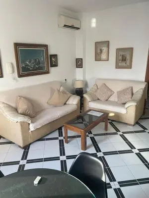 a living room with two couches and a coffee table at Apartamento LUNA in Arcos de la Frontera