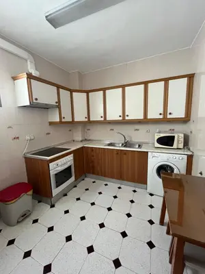 a kitchen with a sink and a stove at Apartamento SOL in Arcos de la Frontera