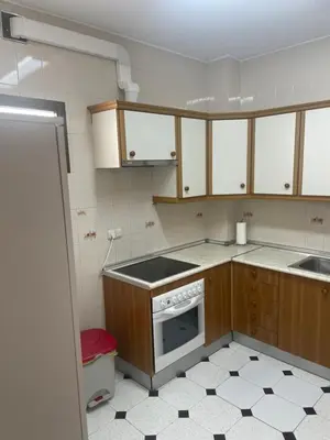 a small kitchen with a stove and a sink at Apartamento SOL in Arcos de la Frontera