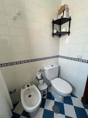 a small bathroom with a toilet and a bidet at Apartamento SOL in Arcos de la Frontera