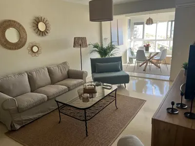 a living room with a couch and a table at La ilusión de Pepa in El Puerto de Santa María
