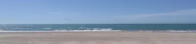an empty beach with the ocean in the background at Piso en la Caleta in Cádiz