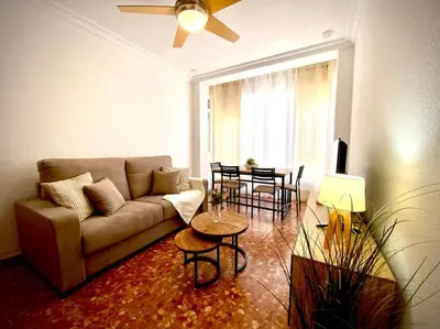 a living room with a couch and a table at MyChoice Casa Milagros in Rota