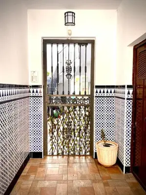 an entrance to a building with a wrought iron door at MyChoice Casa Milagros in Rota