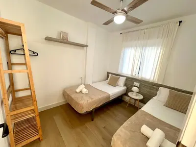 a small room with two beds and a ladder at GATU Villa Mar 