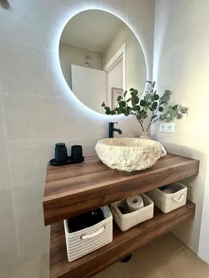 a bathroom with a sink and a mirror at GATU Villa Mar 