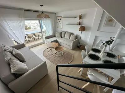 a living room with a couch and a table at GATU Villa Mar 