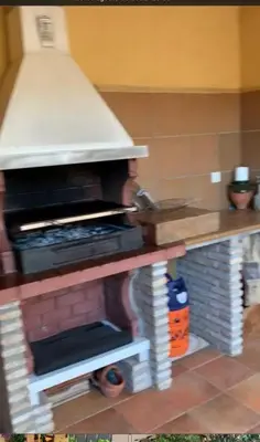 a lego model of a kitchen with a pizza oven at La Bilbaina con Piscina, Jardin y Parking Exclusivo 10 in Chiclana de la Frontera